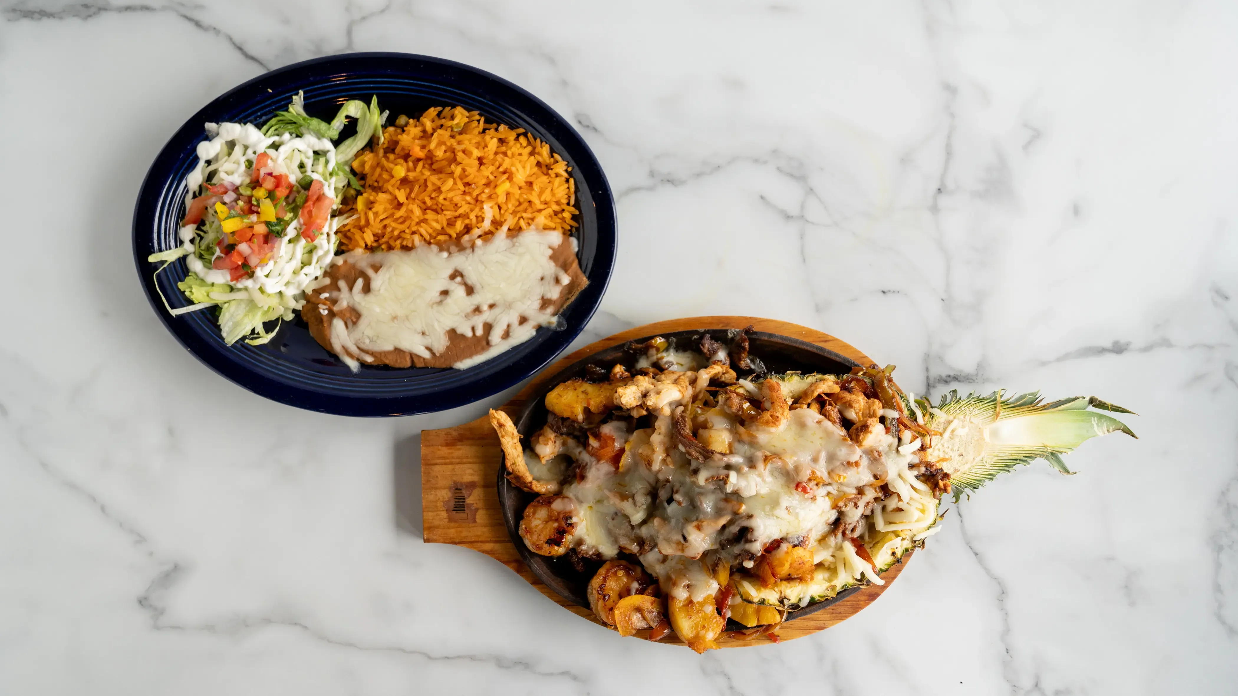 Tropical twist on our classic! Marinated steak, chicken, and shrimp grilled with sweet pineapple, bell peppers, onions, and tomatoes. Island flavors meet Mexican tradition with all the fixings